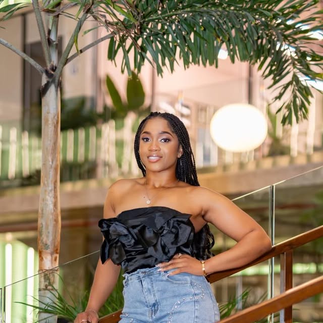 Birthday fashion portrait on a staircase with palm leaves